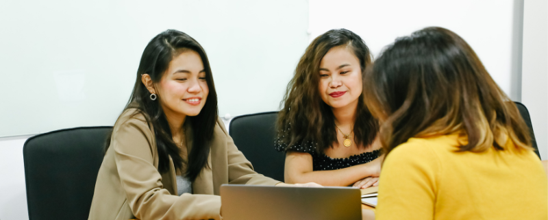 group of women working and discussing