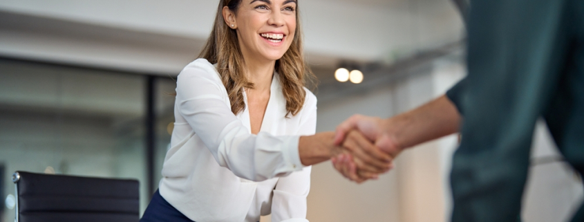 Happy,Mid,Aged,Business,Woman,Manager,Handshaking,Greeting,Client,In