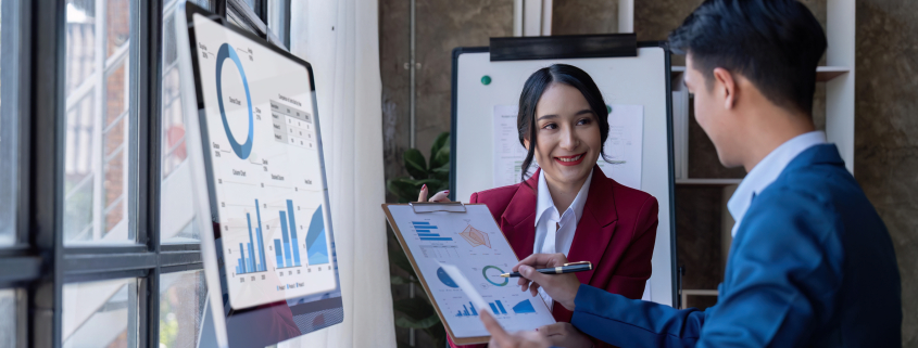 Young Asian business team creative businesspeople coworker in office. Meeting Presentation for tax analysis graph company financial. People Work in Business Office