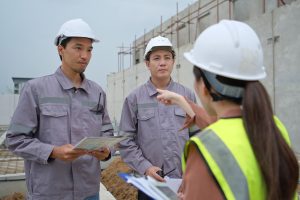construction workers reporting to boss