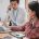 two payroll professionals working